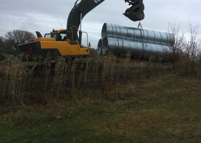 Excavation Crane & 3 Pipes at Next Construction